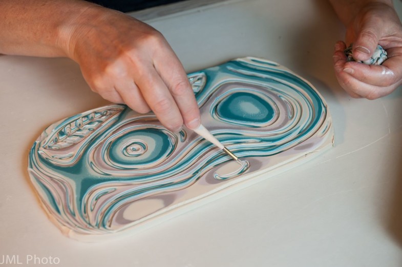 Naomi Lindenfeld carving colored clay